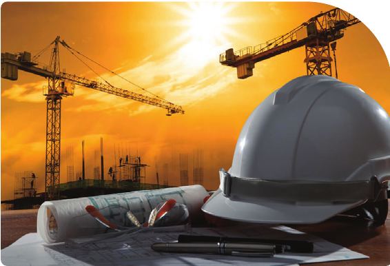 Civil engineering worksite at sunset with crane and site team
