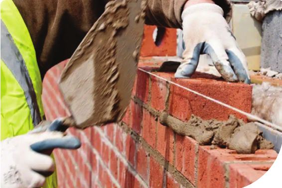 Bricklayer at work on a construction site